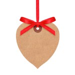 Hanging heart shaped paper tag with red ribbon isolated on white background