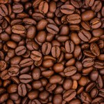 Close-up of roasted coffee beans for background, top view