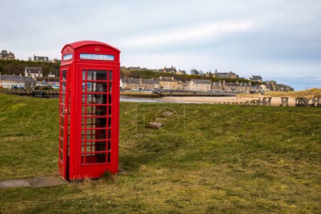 Photo for Red telephone booth in a Scottish seaside town by the beach - Royalty Free Image