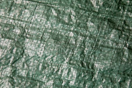Photo for Abstract background with an exquisite mix of wrinkled patterns, green tarpaulin - Royalty Free Image