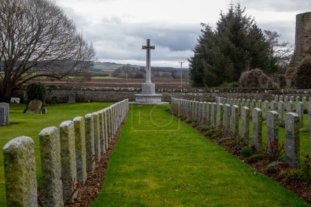 a poignant view of a war cemetery in the countryside in Scotland