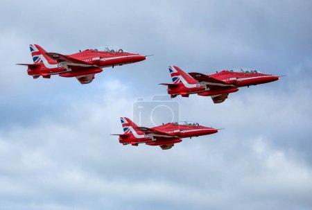 Photo for Aerobatics of red arrow aircrafts at an air show - Royalty Free Image