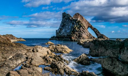 Photo for Beautiful landscape with blue sea, seascape of rocks and Bow Fiddle rock, Scotland - Royalty Free Image