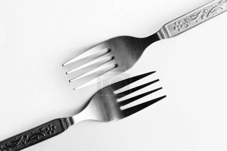 Photo for Vintage engraving silverware fork set of two placed one against other isolated on white background - Royalty Free Image