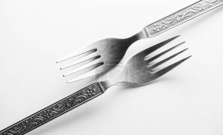 Photo for Vintage engraving silverware fork set of two placed one against another isolated on white background - Royalty Free Image