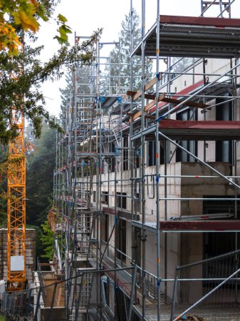 Photo for Building is everyone's business, everyone needs an apartment, scaffolding work on the new building - Royalty Free Image