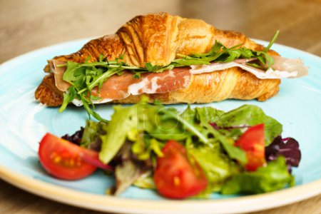 Photo for Croissant with ham, vegetables and cheese. - Royalty Free Image