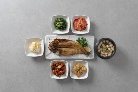 Photo for Grilled hairtail, grilled mackerel, grilled back-handled fish, grilled pollack lunch box Korean food dish - Royalty Free Image