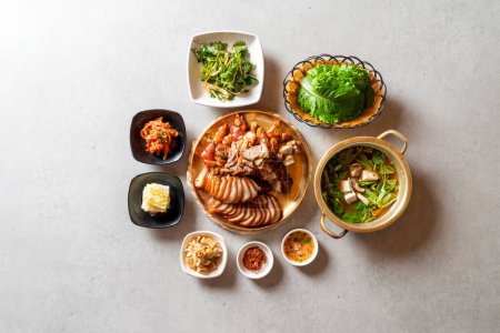 Photo for Jokbal, pork feet, steamed, salted oysters, spicy, noodles, garlic - Royalty Free Image