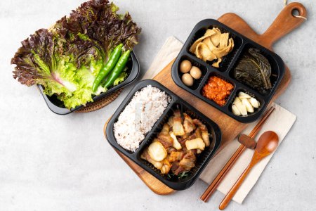 Photo for Korean food, kimchi, stew, lunch box, stir-fried pork, pork, bulgogi, side dishes, tofu, pork belly, lettuce, ribs, cold noodles, quail eggs, perilla leaves, rice, garlic, cucumber - Royalty Free Image