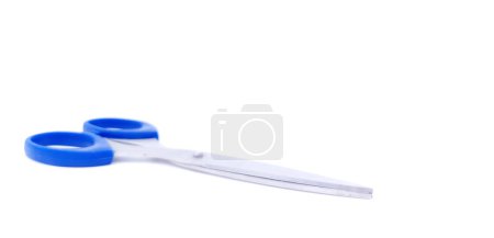 Photo for Scissors with blue handle, isolated on white background with copy space. Shallow depth of field. Side view. - Royalty Free Image