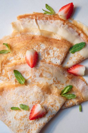 fried airy thin French pancakes.