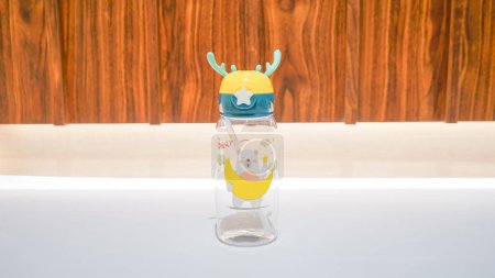 Photo for This Animal Motif Dark Blue and Yellow Kids Water Bottle is perfect for children who need to stay hydrated throughout the day. - Royalty Free Image