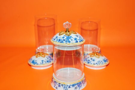 Photo for The Set of Three Glass Jars with Blue Flower Pattern White Lids offers a perfect storage solution for your kitchen or pantry. - Royalty Free Image