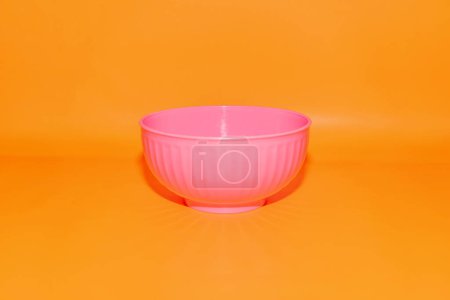 Photo for The Twist Pattern Pink Plastic Bowl is a stylish and functional addition to your kitchenware collection. - Royalty Free Image