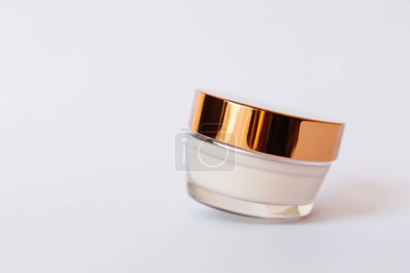 moisturizing cream in glass on white background-stock-photo