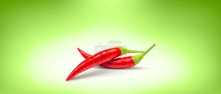 Photo for Red Chili Peppers on Green Background - Product Label Concept & Idea - Royalty Free Image