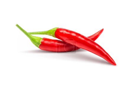 Photo for Red Chili Peppers on Green Background - Royalty Free Image