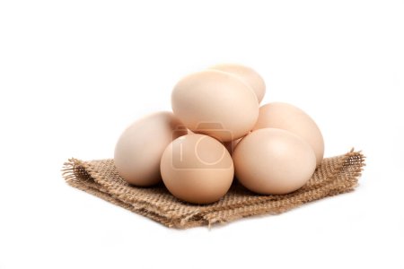 Photo for Brown Chicken Eggs on a Rustic Fabric, Organic Eggs. - Royalty Free Image