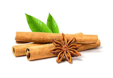 Photo for Cinnamon Sticks, Anise Star and Leafs in White Background - Royalty Free Image