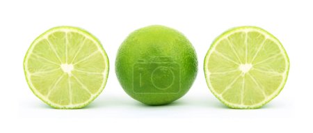 Photo for Green Lemon and Slice on a white surface. Summer Season Fruit. - Royalty Free Image