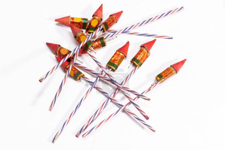 Photo for Pile of colorful fireworks rockets isolated on white background. - Royalty Free Image