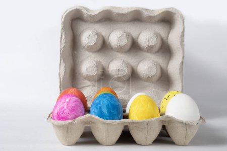 Photo for Easter eggs in a cardboard tray on a white background. Easter concept. - Royalty Free Image