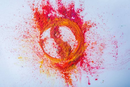 Multicolored holi powder in the form of a circle on a white background. Holi festival concept.