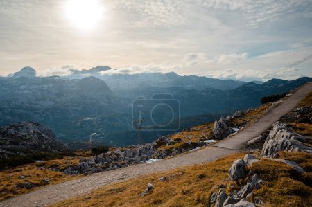 Photo for Panoramic view of the mountain village in the Austrian Alps. Autumn Landscape. Dachstein, Austria. Blue sky and mountains. Beautiful and cozy town. Postcard concept - Royalty Free Image