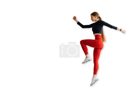 Photo for Sporty woman runner in silhouette on white background. Photo of attractive woman in fashionable sportswear. Dynamic movement. Side view. Sport and healthy lifestyle - Royalty Free Image