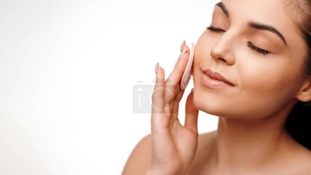 Photo for Healthy woman touching pure face skin at white background. Spa beautiful female and healthcare concept. Stock photo - Royalty Free Image