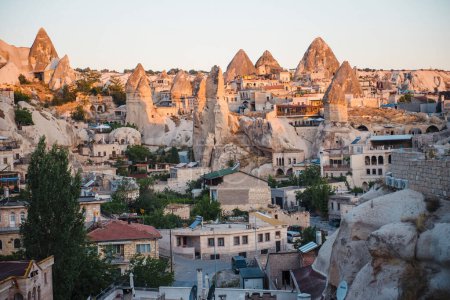 Photo for Fascinating view of turkish city made in rocks. Famous place among travellers. Preservation of old architecture in buildings. Goreme in Cappadocia region. - Royalty Free Image
