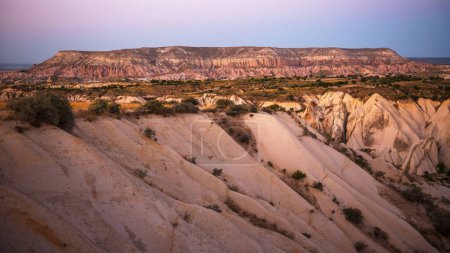 Photo for Scenic view of natural formation with rocks and sand in Turkey during sunset. Famous valley in Cappadocia region. Interesting place to visit for tourists. - Royalty Free Image