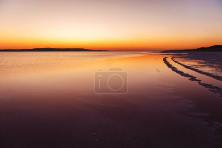 Photo for Beautiful view of pink salt in large turkish lake. Natural combination of colors during sunset. Trendy backdrop and wallpaper. - Royalty Free Image