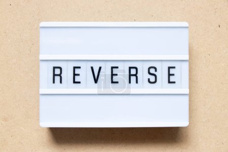 Photo for Lightbox with word reverse on wood background - Royalty Free Image