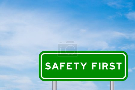 Green color transportation sign with word safety first on blue sky with white cloud background