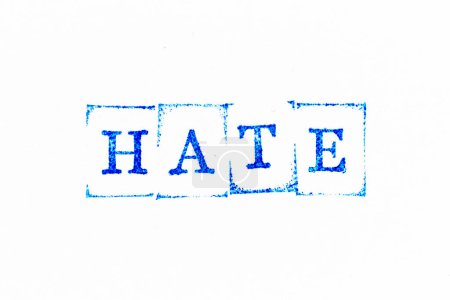 Photo for Blue color ink rubber stamp in word hate on white paper background - Royalty Free Image