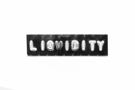 Téléchargez les photos : Embossed letter with word liquidity in black banner on white paper background - en image libre de droit