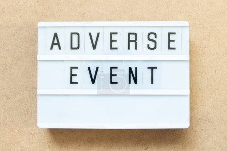 Photo for Lightbox with word adverse event on wood background - Royalty Free Image