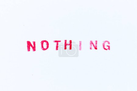 Photo for Red color ink rubber stamp in word nothing on white paper background - Royalty Free Image