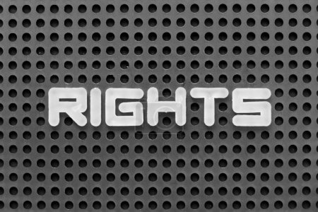 Photo for White alphabet letter in word rights on black pegboard background - Royalty Free Image