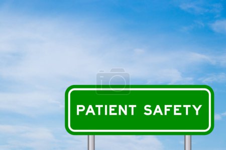 Green color transportation sign with word patient safety on blue sky with white cloud background