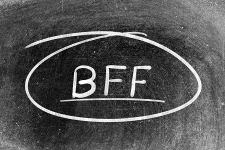 Photo for White chalk hand writing in word BFF (Abbreviation of best friend forever) and circle shape on blackboard background - Royalty Free Image