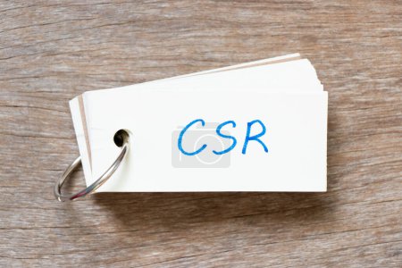 Photo for Flash card with handwriting in word CSR (Abbreviation of corporate social responsibility) on wood background - Royalty Free Image