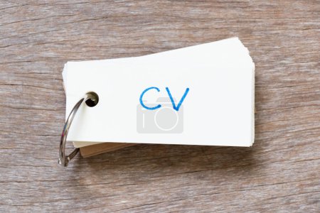 Photo for Flash card with handwriting in word CV (Abbreviation of curriculum vitae) on wood background - Royalty Free Image