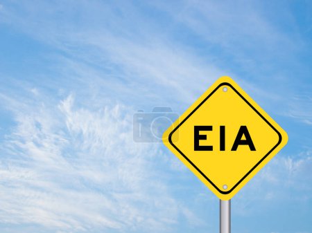 Photo for Yellow transportation sign with word EIA (abbreviation of Environmental Impact Assessment) on blue color sky background - Royalty Free Image