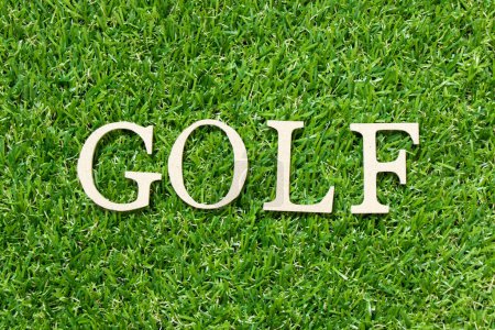 Photo for Wood letter in word golf on green grass background - Royalty Free Image