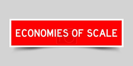 Ilustración de Etiqueta engomada con palabras economías de escala en color rojo sobre fondo gris - Imagen libre de derechos