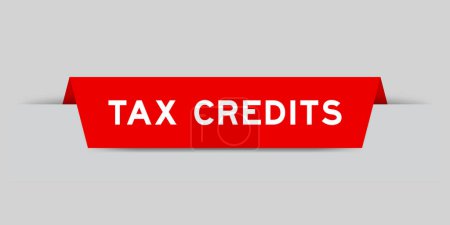 Red color inserted label with word tax credits on gray background