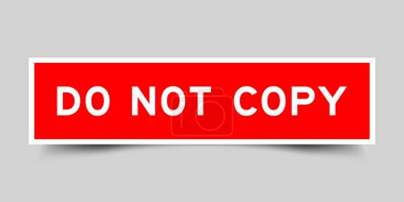 Red color square label sticker with word do not copy that inserted in gray background